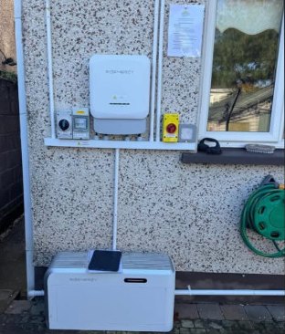 Sigenergy inverter and consumer unit on a pebbledash wall